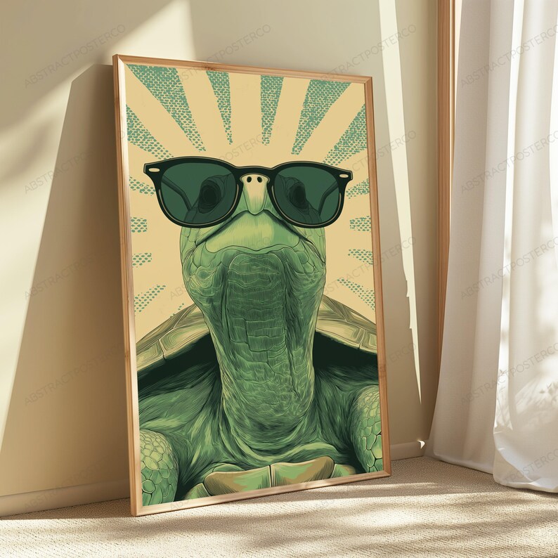 May include: A rectangular wall art print featuring a green turtle wearing black sunglasses. The turtle is centered against a light yellow background with a radiating sunburst pattern in a darker green, stippled texture design.