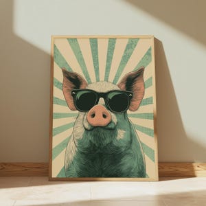 May include: A rectangular wall art print featuring a stylised illustration of a pig wearing black sunglasses. The pig is centred against a background of radiating teal and beige sunburst stripes with a subtle dotted texture throughout the design.