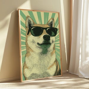 May include: A framed wall art print featuring a detailed illustration of a Shiba Inu dog wearing black sunglasses. The dog is centred against a background of radiating light green and cream-coloured sunburst lines, creating a graphic visual effect.