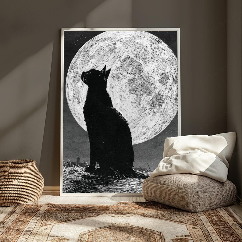 May include: A rectangular wall art print featuring a black cat silhouette sitting in profile, looking up at a large, textured white full moon against a dark, starry night sky. The artwork is rendered in a high-contrast black and white style.
