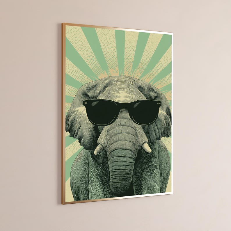 May include: A rectangular wall art print featuring a detailed illustration of a grey elephant wearing black sunglasses. The background consists of a light green and cream-coloured sunburst pattern with a dotted texture throughout the design.