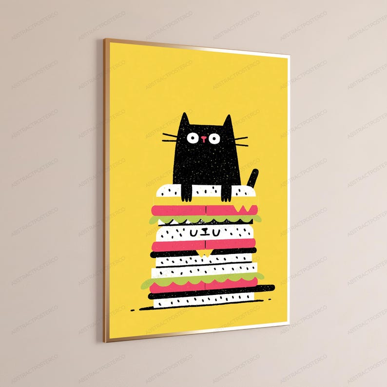 May include: A framed vertical wall art print featuring a black cat with wide eyes sitting atop a tall, multi-layered sandwich. The background is a solid bright yellow, and the sandwich consists of white bread, pink meat, and green lettuce layers.