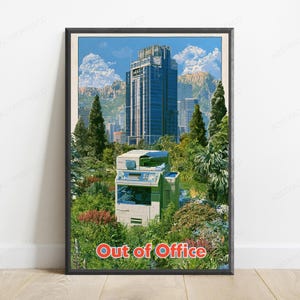 May include: A framed poster featuring a large office printer situated in a lush green garden with trees and shrubs. In the background, a tall blue skyscraper stands against a mountain range and blue sky. The text Out of Office is at the bottom.