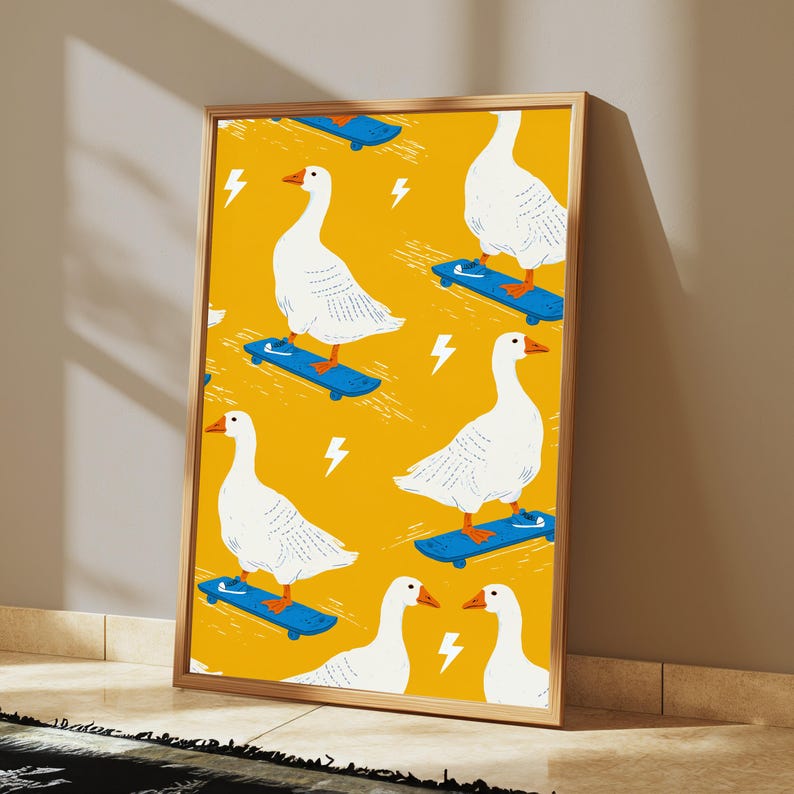 May include: A framed vertical art print featuring a repeating pattern of white geese on skateboards against a vibrant mustard yellow background. Each goose wears small blue sneakers, and the design includes scattered white lightning bolt icons.