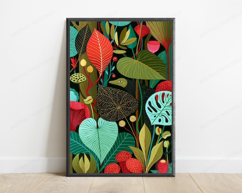 May include: A rectangular framed wall art print featuring a dense jungle scene with a black background. The illustration displays various stylized tropical leaves in shades of red, teal, green, and yellow, alongside small berries and a hidden bird.