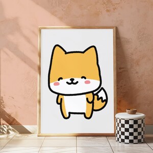 May include: A framed wall art print featuring a cartoon illustration of a small, yellow and white fox-like creature with a thick black outline, closed eyes, a small black nose, and pink circular cheeks, set against a plain white background.