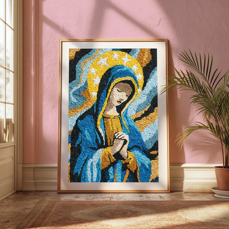 May include: A framed textile art piece depicting a figure with a blue head covering and gold garment, hands clasped in prayer. A yellow halo with white stars surrounds the head, set against a textured background of swirling blue and gold.