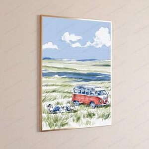 May include: A framed wall art print featuring a watercolor illustration of a red and white vintage camper van parked in a grassy field under a blue sky with white clouds. Two figures are relaxing in lounge chairs next to the vehicle.