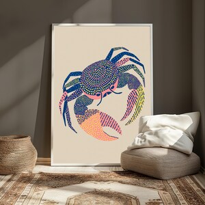 May include: A framed wall art print featuring a stylized crab illustration on a light beige background. The crab is rendered with a pattern of blue, pink, and yellow dots and lines, showcasing a large pincer and multiple legs in a graphic design.