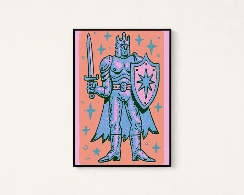 May include: A framed art print featuring a stylized illustration of a knight in armor holding a sword and a shield with a star emblem. The figure is rendered in shades of blue and pink against a coral background, surrounded by small star shapes.