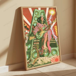 May include: A framed poster featuring a person in a pink and blue striped kimono playing a light green electric guitar. The figure sits atop a large stack of green speakers and electronic equipment under a bright sun and lightning bolt.