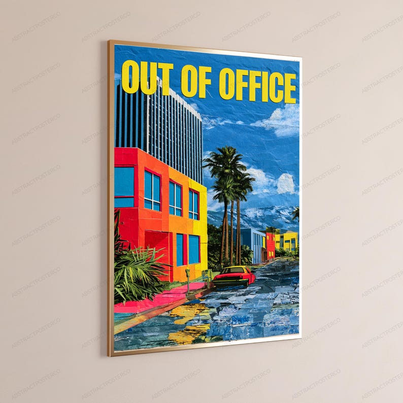 May include: A framed wall art print featuring a vibrant urban scene with a tall building in shades of orange, yellow, and blue. The text OUT OF OFFICE is printed in yellow at the top. A red car sits on a street with palm trees and mountains.