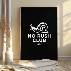 May include: A rectangular black wall art print featuring a white graphic of a snail. Below the snail, the text reads NO RUSH CLUB in a bold, sans-serif font, followed by the acronym NRC in a smaller, matching white font style.