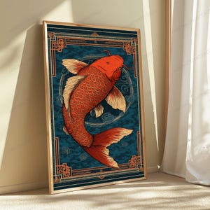 May include: A rectangular wall art print featuring a vibrant orange koi fish swimming in a circular motion against a dark blue textured background. The artwork is framed by a geometric orange border with intricate corner patterns and lines.