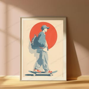 May include: A framed poster featuring a stylized illustration of a person wearing a cap, jacket, and pants, carrying a backpack while riding a skateboard. The background displays a large solid red circle against a cream-colored backdrop.