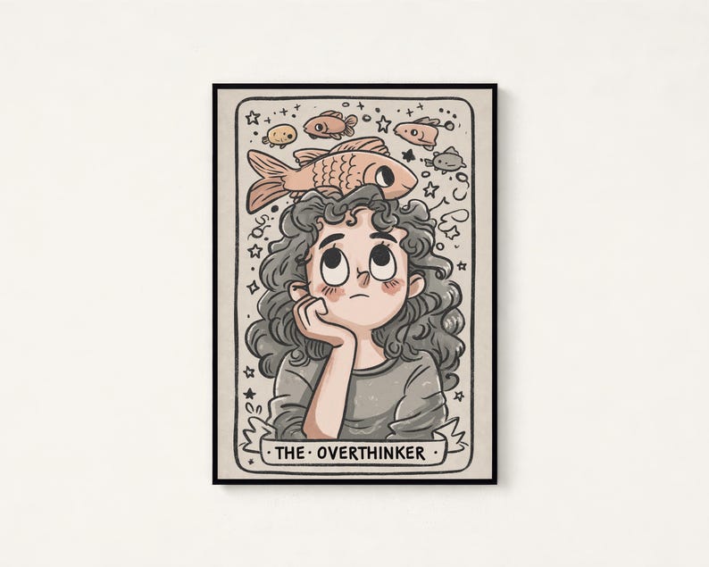 May include: A rectangular art print featuring a cartoon illustration of a person with curly hair resting their chin on a hand. Above the head are several fish and stars. The text THE OVERTHINKER is printed on a banner at the bottom of the image.