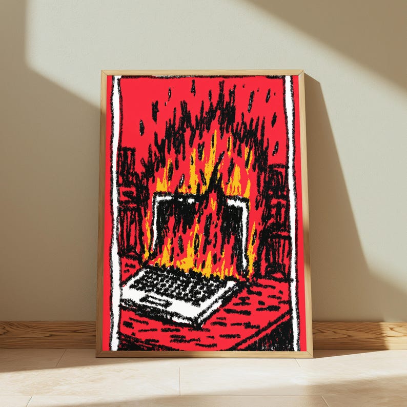 May include: A rectangular wall art print featuring a stylized, hand-drawn illustration of a laptop engulfed in bright yellow and orange flames against a vibrant red background. The artwork uses bold black outlines and a textured, sketch-like aesthetic.