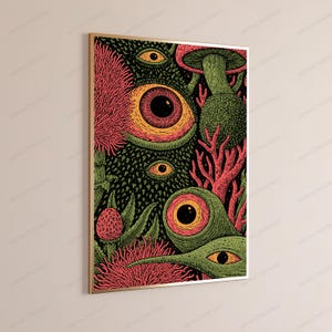 May include: A rectangular wall art print in a thin gold frame featuring a dense, surreal illustration. The artwork displays multiple large, wide-open eyes with orange and yellow irises, surrounded by green textured foliage, pink coral-like structures, and a single mushroom against a dark background.