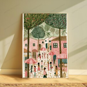 May include: A vertical art print depicting a cobblestone street scene with pink buildings, tall green trees, and people walking under pink and white striped umbrellas. The illustration features a soft colour palette with muted tones of pink, green, and brown.