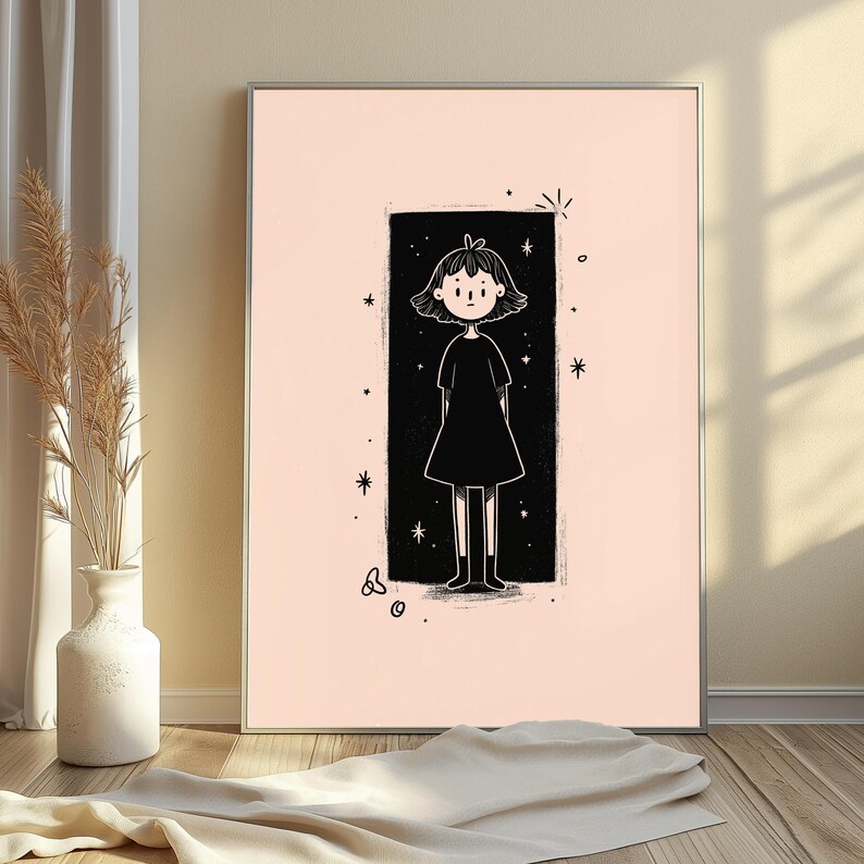 May include: A rectangular wall art print featuring a black and white line drawing of a person with short hair wearing a dress, centred within a solid black vertical rectangle on a pale pink background, surrounded by small star and circle motifs.