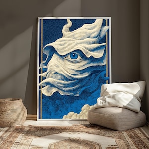 May include: A rectangular wall art print featuring a stylized, flowing cream-colored fabric form with a single, detailed blue eye at its center. The background is a deep navy blue with textured, cloud-like patterns in blue and cream tones.