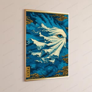 May include: A rectangular wall art print featuring a stylized, flowing white entity with a single prominent blue eye, set against a deep blue background with swirling patterns and gold-toned cloud motifs. A vertical black text box is in the corner.