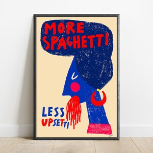 May include: A framed wall art print on a cream background featuring a blue stylized figure with dark blue hair, a red hoop earring, and a red cheek. The figure has red spaghetti coming from the mouth. Text reads MORE SPAGHETTI! LESS UPSETTI.