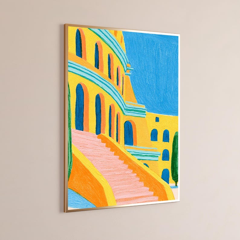 May include: A framed art print featuring a vibrant painting of a yellow building with blue arched windows and a pink staircase. The scene includes tall green cypress trees against a bright blue sky, rendered in a textured, painterly style.