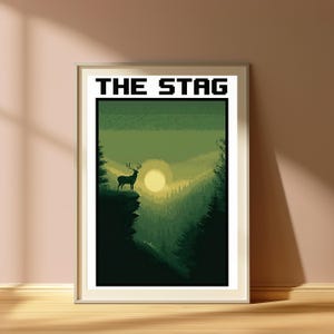 May include: A framed rectangular wall art print featuring a pixel art landscape in shades of green. The image depicts a stag standing on a cliff edge overlooking a forest valley with a pale yellow sun. The text THE STAG is printed in black.