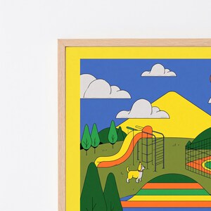May include: A framed wall art print featuring a colorful cartoon landscape with a yellow mountain, blue sky, white clouds, green trees, and an orange slide. A small white and yellow dog stands on the grass near a playground structure.