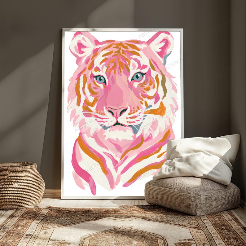May include: A vertical rectangular wall art print featuring a stylized tiger portrait. The tiger is rendered in shades of pink, white, and orange with distinct brushstroke textures. It has bright blue eyes and a white background within a thin frame.