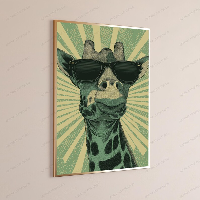 May include: A framed wall art print featuring a stylized illustration of a giraffe wearing black sunglasses. The giraffe is rendered in shades of green and black against a background of radiating light green and cream-colored sunburst rays.
