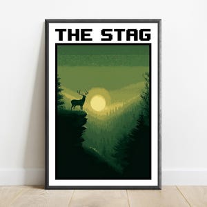 May include: A framed rectangular wall art print featuring the text THE STAG in a black pixelated font. The illustration depicts a silhouette of a stag standing on a cliff edge overlooking a forest valley with a large pale sun in a green sky.