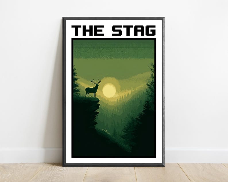 May include: A framed rectangular wall art print featuring the text THE STAG in a black pixelated font. The illustration depicts a silhouette of a stag standing on a cliff edge overlooking a forest valley with a large pale sun in a green sky.