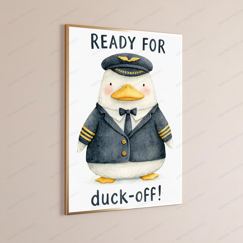 May include: A framed wall art print featuring a watercolor illustration of a white duck dressed as a pilot in a dark blue uniform with gold stripes, a tie, and a cap. The text reads READY FOR at the top and duck-off! at the bottom.