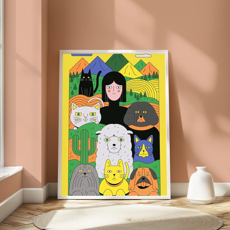 May include: A framed vertical art print featuring a central human figure surrounded by a collection of stylised animals including cats, dogs, and a sheep against a yellow background with green hills, a cactus, and colourful mountains in the distance.