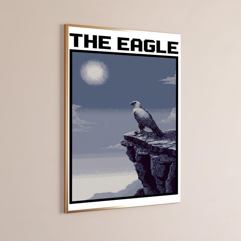 May include: A framed pixel art poster titled THE EAGLE featuring a white and dark blue eagle perched on a jagged cliff edge. The scene includes a pale sun in a blue sky with clouds above a distant landscape, rendered in a retro digital style.