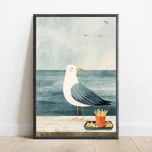 May include: A framed wall art print featuring a white and gray seagull standing on a wooden pier. The bird is positioned next to a small orange container filled with french fries. The background shows a blue ocean and a pale sky with birds.