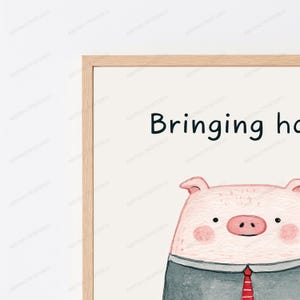 May include: A framed wall art print featuring a watercolor illustration of a pig wearing a dark gray suit jacket and a red tie. The text "Bringing ho" is visible at the top against a cream background. The frame is made of light-colored wood.