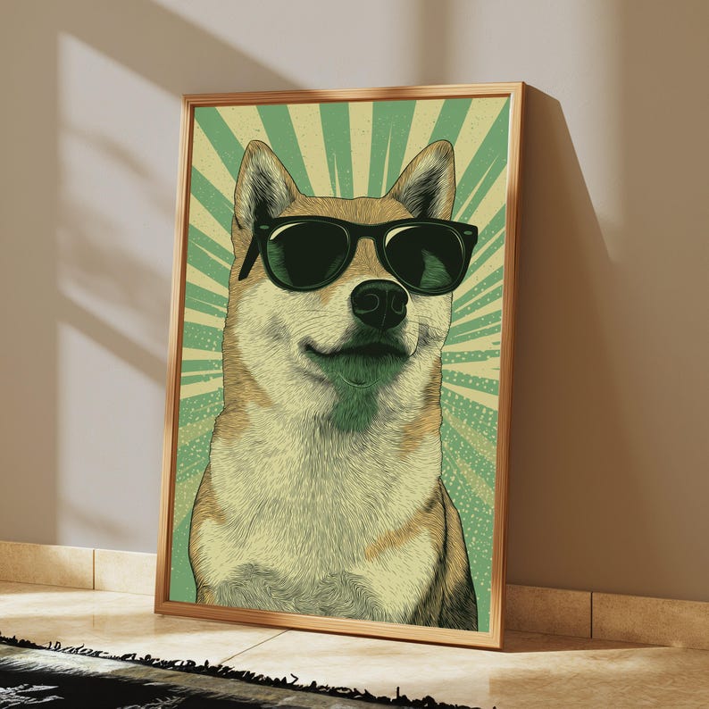May include: A framed wall art print featuring a stylised illustration of a Shiba Inu dog wearing black sunglasses. The dog is centred against a background of radiating light green and cream-coloured sunburst lines with a subtle dotted texture.