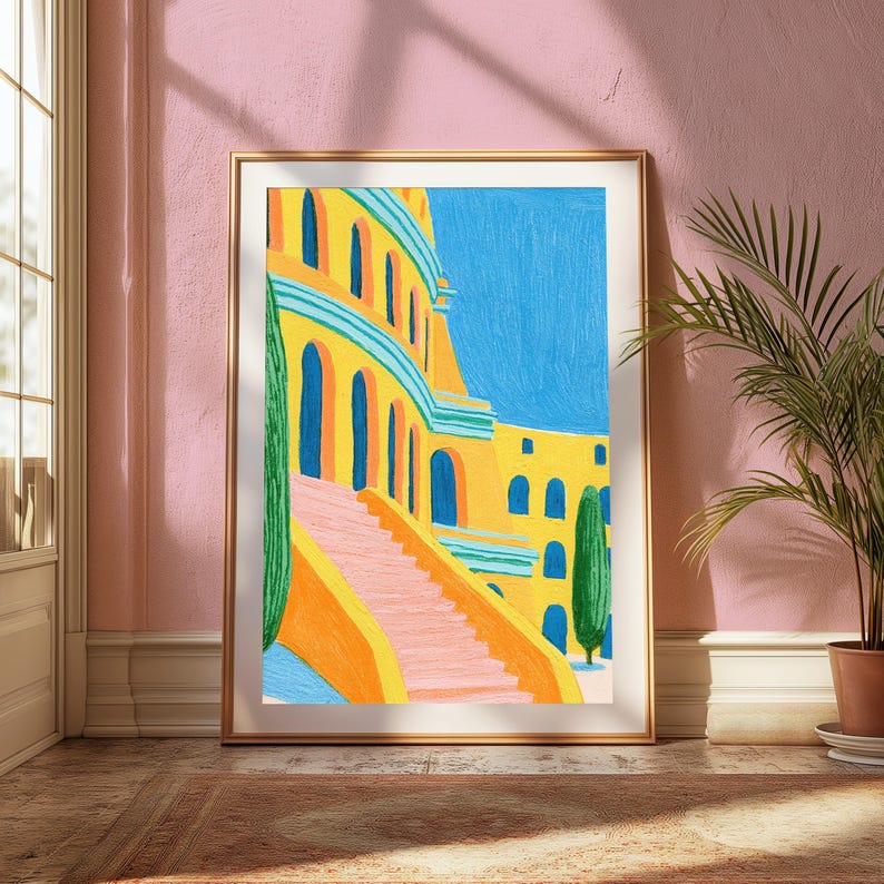 May include: A framed art print featuring a vibrant painting of a yellow building with arched doorways and a pink staircase. The scene includes tall green cypress trees against a bright blue sky, rendered with visible brushstrokes in a colourful style.