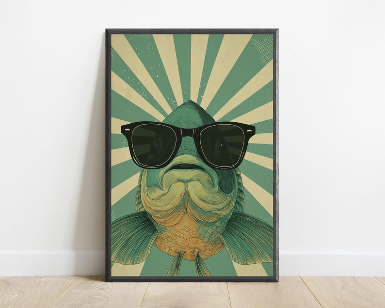 May include: A rectangular wall art print featuring a stylised illustration of a fish wearing black sunglasses. The fish is centred against a background of alternating teal and cream-coloured sunburst rays, creating a bold graphic design.