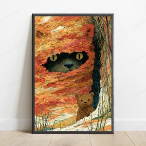 May include: A framed wall art print featuring a textured, orange and yellow abstract landscape with a dark, hidden creature peering out from a central opening. A small, brown, furry animal figure stands in the lower right foreground of the scene.
