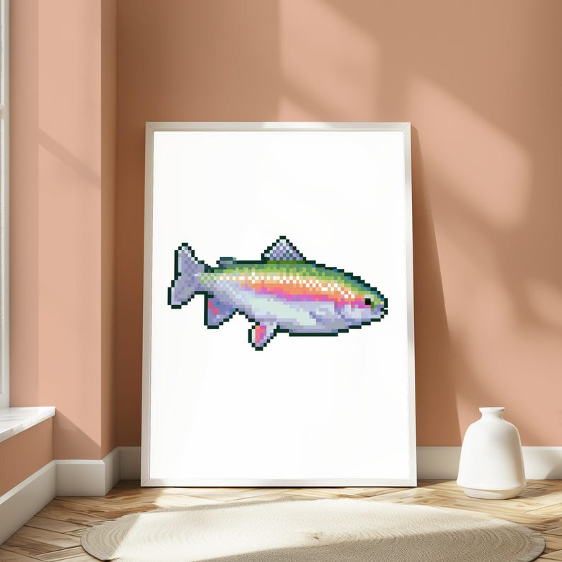 May include: A framed wall art print featuring a pixel art illustration of a rainbow trout. The fish is rendered in a digital style with a gradient of green, pink, and silver scales, a dark eye, and distinct fins, centered on a plain white background.