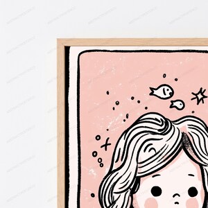 May include: A framed wall art print featuring a stylized illustration of a person with wavy hair against a soft pink background. The artwork includes black line drawings of small fish, stars, and circular dots, all enclosed within a light wood frame.