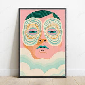 May include: A framed art print featuring a stylized portrait of a person with dark teal hair against a pink background. The person has large, concentric, wavy-lined shapes covering their eyes in shades of teal, orange, and cream, with teal lips.