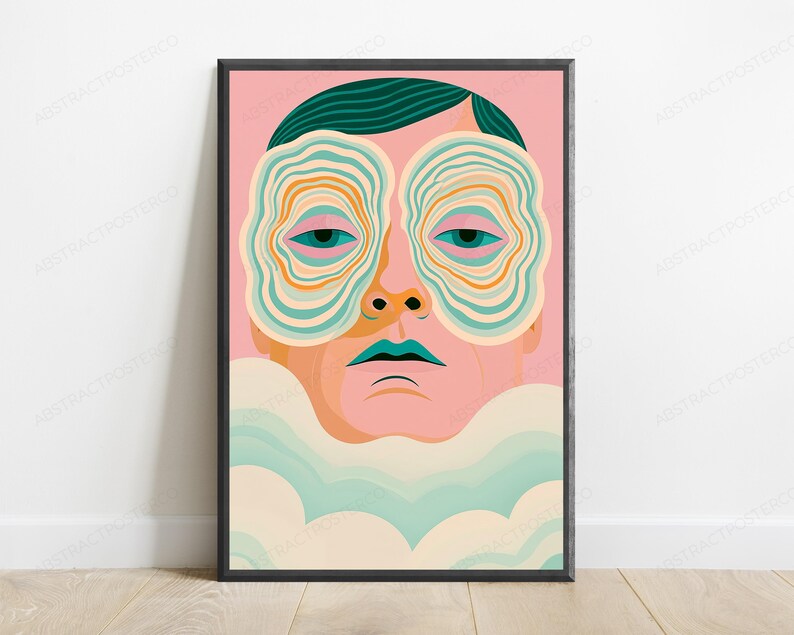 May include: A framed art print featuring a stylized portrait of a person with dark teal hair against a pink background. The person has large, concentric, wavy-lined shapes covering their eyes in shades of teal, orange, and cream, with teal lips.