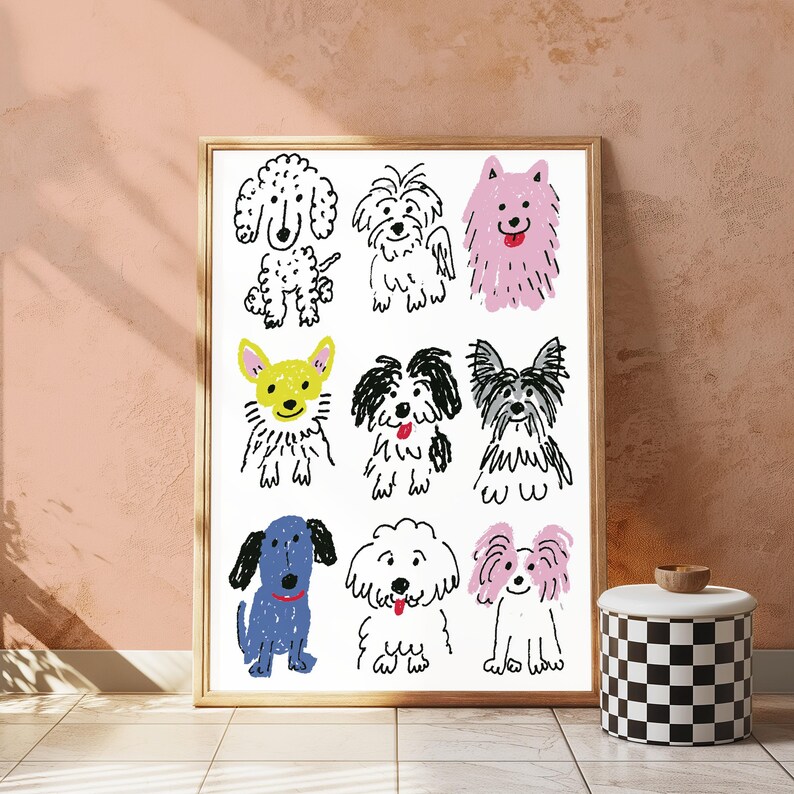 May include: A framed wall art print featuring a grid of nine hand-drawn dog illustrations in a crayon-like style. The dogs are depicted in various colors including black, white, pink, yellow, and blue, showcasing different breeds and expressions.