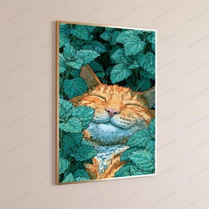 May include: A framed vertical wall art print featuring an orange tabby cat with closed eyes, resting peacefully amidst a dense cluster of vibrant teal and green mint leaves. The cat has a soft expression, with its face nestled in the foliage.