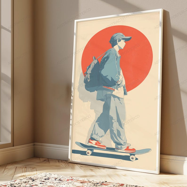 May include: A framed poster featuring a stylized illustration of a person wearing a cap, jacket, and backpack while riding a skateboard. The design includes a large red circle against a cream background, with the figure rendered in shades of blue.